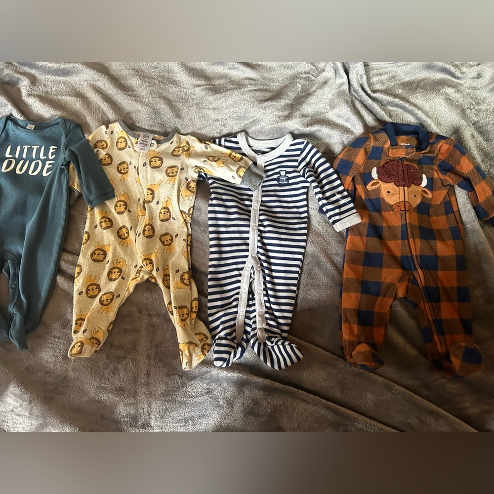 Baby boy 0-3 and 3 months sleepers, four in total.